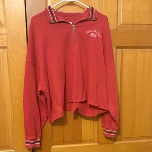 American Eagle Outfitters cropped red zip sweatshirt.